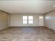 Spacious living area with wood-look floors and an abundance of natural light at 6545 Old Jefferson Davis Hwy, Cameron, NC 28326