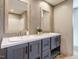 Modern double vanity bathroom with gray cabinets and stylish mirrors at 6567 Old Jefferson Davis Hwy, Cameron, NC 28326