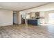 Open kitchen with island, stainless steel appliances, and white cabinets at 6567 Old Jefferson Davis Hwy, Cameron, NC 28326