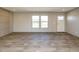 Living room with wood-look floors and large windows at 6567 Old Jefferson Davis Hwy, Cameron, NC 28326