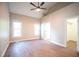 Spacious bedroom featuring hardwood floors and a ceiling fan at 105 Tracey Creek Ct Ct, Apex, NC 27502