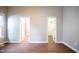 Bright bedroom with wood-look floors, en-suite bathroom, and walk-in closet at 105 Tracey Creek Ct Ct, Apex, NC 27502