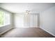 Bright bedroom featuring carpet, ceiling fan and double closets at 105 Tracey Creek Ct Ct, Apex, NC 27502