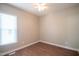Bedroom with wood-look floors and window with blinds at 105 Tracey Creek Ct Ct, Apex, NC 27502