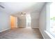 Well-lit bedroom with carpet, ceiling fan and window at 105 Tracey Creek Ct Ct, Apex, NC 27502