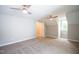Spacious bedroom with two ceiling fans and an additional room at 105 Tracey Creek Ct Ct, Apex, NC 27502