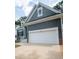 Gray house with white garage door and brick base at 105 Tracey Creek Ct Ct, Apex, NC 27502