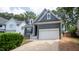 Gray house with white garage door and brick accents at 105 Tracey Creek Ct Ct, Apex, NC 27502