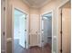 Bright hallway with hardwood floors and multiple doors leading to other rooms at 105 Tracey Creek Ct Ct, Apex, NC 27502