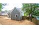 Gray house back, fenced yard, and trees at 105 Tracey Creek Ct Ct, Apex, NC 27502