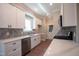Modern kitchen with white cabinets, stainless steel appliances, and quartz countertops at 105 Tracey Creek Ct Ct, Apex, NC 27502