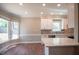 Modern kitchen with white cabinets, stainless steel appliances, and quartz countertops at 105 Tracey Creek Ct Ct, Apex, NC 27502