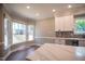 Modern kitchen with white cabinets, stainless steel appliances, and quartz countertops at 105 Tracey Creek Ct Ct, Apex, NC 27502