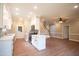 Modern kitchen with white cabinets, stainless steel appliances, and quartz countertops at 105 Tracey Creek Ct Ct, Apex, NC 27502