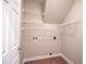 Laundry room with wire shelving and vinyl flooring at 105 Tracey Creek Ct Ct, Apex, NC 27502
