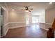 Living room with hardwood floors and ceiling fan at 105 Tracey Creek Ct Ct, Apex, NC 27502