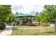 Community playground with shaded play area at 105 Tracey Creek Ct Ct, Apex, NC 27502