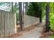 Sidewalk next to wooden fence and trees at 105 Tracey Creek Ct Ct, Apex, NC 27502