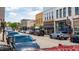 Image of a town square with parked cars and shops at 105 Tracey Creek Ct Ct, Apex, NC 27502