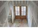 Double front doors leading into the foyer of a new home at 1401 Cottondale Ln, Wake Forest, NC 27587