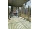 Unfinished screened porch with wood flooring and fireplace at 1401 Cottondale Ln, Wake Forest, NC 27587