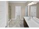 Bathroom with double vanity, shower, and linen closet at 1813 Ferrell Meadows Dr, Zebulon, NC 27597