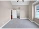 Bright bedroom featuring a walk-in closet and ceiling fan at 1813 Ferrell Meadows Dr, Zebulon, NC 27597