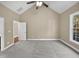 Spacious bedroom with large window and ceiling fan at 1813 Ferrell Meadows Dr, Zebulon, NC 27597