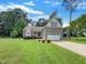 Charming single-Gathering home featuring a two-car garage, manicured lawn, and beautiful landscaping at 1813 Ferrell Meadows Dr, Zebulon, NC 27597