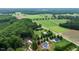 Aerial view highlighting properties with mature trees, lush lawns, and various architectural styles at 20 Tamaran Ct, Spring Hope, NC 27882