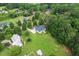 Aerial view of new construction home sitting on large private lot surrounded by mature trees at 20 Tamaran Ct, Spring Hope, NC 27882