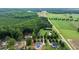 Aerial view showcasing properties with mature trees, lush lawns, and various architectural styles at 20 Tamaran Ct, Spring Hope, NC 27882