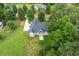 Aerial view of new construction home in private back yard surrounded by mature trees at 20 Tamaran Ct, Spring Hope, NC 27882