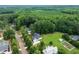 Aerial view of new construction home sitting on large private lot surrounded by mature trees at 20 Tamaran Ct, Spring Hope, NC 27882