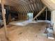 Spacious unfinished attic with wood beams and insulation at 20 Tamaran Ct, Spring Hope, NC 27882
