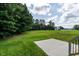 Expansive backyard with mature trees and a concrete patio, perfect for outdoor entertaining at 20 Tamaran Ct, Spring Hope, NC 27882