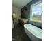 Stylish bathroom with double vanity, standalone tub, shower and view at 20 Tamaran Ct, Spring Hope, NC 27882