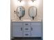 Modern bathroom features a double vanity with quartz countertop and black hardware at 20 Tamaran Ct, Spring Hope, NC 27882