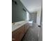 Bathroom with double sink vanity, standalone tub, glass-enclosed shower, and modern fixtures at 20 Tamaran Ct, Spring Hope, NC 27882