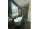 Bright bathroom featuring a standalone tub, glass-enclosed shower, and modern finishes at 20 Tamaran Ct, Spring Hope, NC 27882