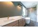 Modern bathroom with double vanity, standing tub, and glass shower with tiled walls at 20 Tamaran Ct, Spring Hope, NC 27882
