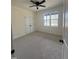 This bedroom offers a ceiling fan, closet, window, and neutral carpet at 20 Tamaran Ct, Spring Hope, NC 27882