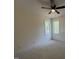 This bright bedroom features two windows and neutral carpet at 20 Tamaran Ct, Spring Hope, NC 27882