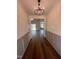 Welcoming entryway with hardwood floors, wainscoting, and stylish light fixture at 20 Tamaran Ct, Spring Hope, NC 27882