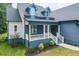 Inviting home with a charming porch, stylish railing, dormer windows, and landscaped surroundings at 20 Tamaran Ct, Spring Hope, NC 27882