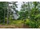 Exterior of the home surrounded by mature trees and greenery at 20 Tamaran Ct, Spring Hope, NC 27882