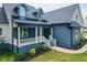 Charming home with a cozy porch, stylish railing, dormer windows, and well-maintained landscaping at 20 Tamaran Ct, Spring Hope, NC 27882