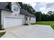 Exterior shot of the home's garage and driveway offering plenty of parking space at 20 Tamaran Ct, Spring Hope, NC 27882