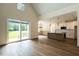 Bright kitchen with an island, white cabinets, stainless appliances, and large windows at 20 Tamaran Ct, Spring Hope, NC 27882