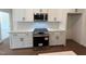 Well appointed kitchen with stainless steel oven and microwave, white cabinets, and modern appliances at 20 Tamaran Ct, Spring Hope, NC 27882